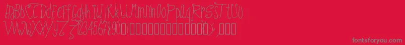 Pwfairytales-fontti – harmaat kirjasimet punaisella taustalla