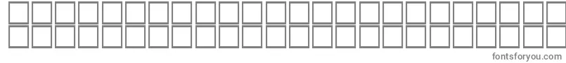 フォントKufiItalic – 白い背景に灰色の文字