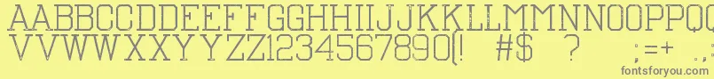 フォントTheNest – 黄色の背景に灰色の文字