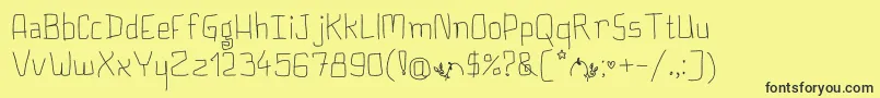 Fonte PlumpyButCute – fontes pretas em um fundo amarelo
