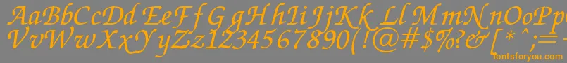 フォントChancery – オレンジの文字は灰色の背景にあります。