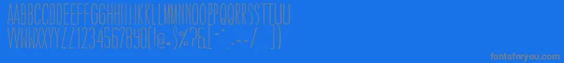 CaledoLightWebfont-fontti – harmaat kirjasimet sinisellä taustalla
