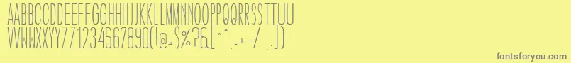 フォントCaledoLightWebfont – 黄色の背景に灰色の文字
