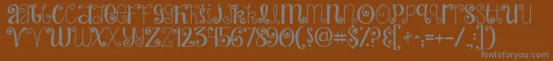 Jandahideandseek Font – Gray Fonts on Brown Background