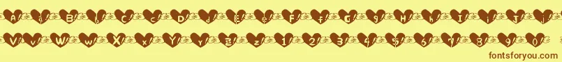 Fonte Heart Font – fontes marrons em um fundo amarelo