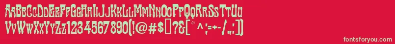 TraktirModern-Schriftart – Grüne Schriften auf rotem Hintergrund