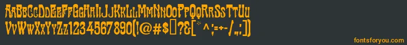 フォントTraktirModern – 黒い背景にオレンジの文字