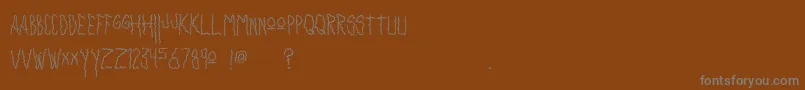 fuente Insanity – Fuentes Grises Sobre Fondo Marrón