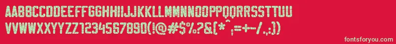 SablonSuperWashed-Schriftart – Grüne Schriften auf rotem Hintergrund