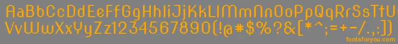 フォントNovaslim – オレンジの文字は灰色の背景にあります。