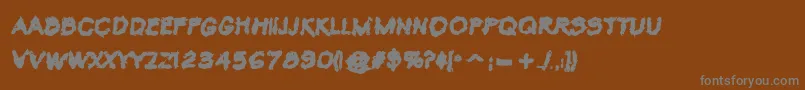 フォントVtcKrinkleKutBold – 茶色の背景に灰色の文字