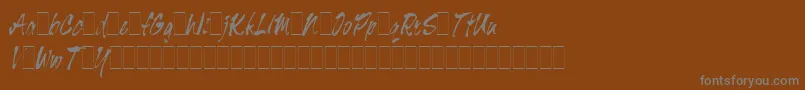 フォントTigerRagAltsLetPlain.1.0 – 茶色の背景に灰色の文字