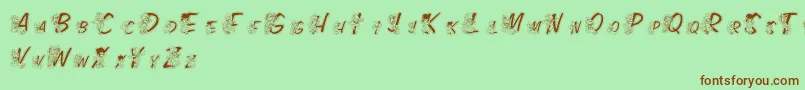 Fonte LmsColorKidsOutlined – fontes marrons em um fundo verde