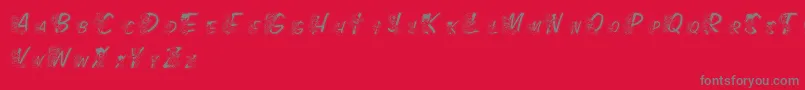 Fonte LmsColorKidsOutlined – fontes cinzas em um fundo vermelho