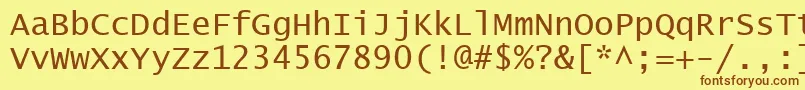 フォントLucon – 茶色の文字が黄色の背景にあります。