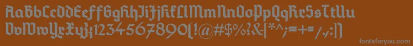 DeutschGotisch-fontti – harmaat kirjasimet ruskealla taustalla