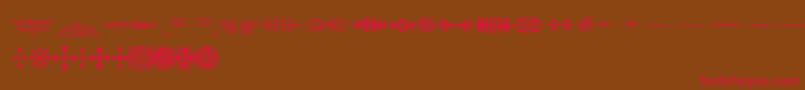 AdobeWoodTypeOrnamentsOne Font – Red Fonts on Brown Background