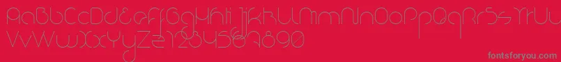 NioubesLight-fontti – harmaat kirjasimet punaisella taustalla