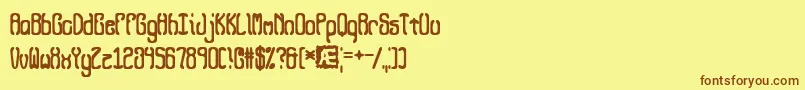 フォントQueasy – 茶色の文字が黄色の背景にあります。