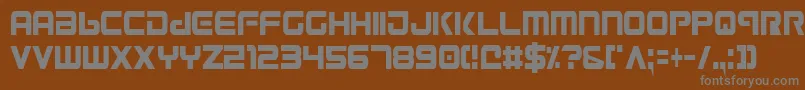 Gunv2c-fontti – harmaat kirjasimet ruskealla taustalla