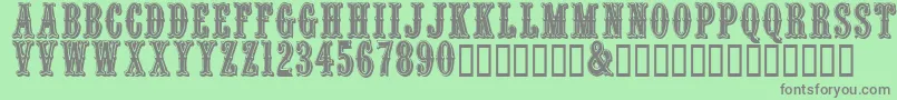 More about Quentincaps Font Quentincaps Font – Gray Fonts on Green Background