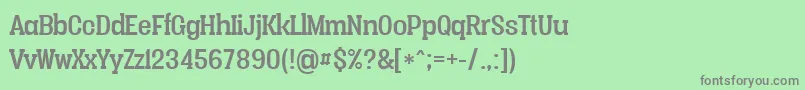 Vacerserifregularpersonal-fontti – harmaat kirjasimet vihreällä taustalla