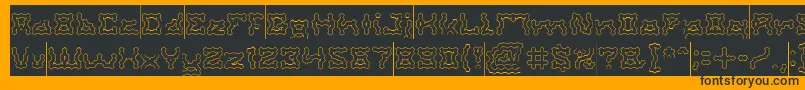 Czcionka ShakeItOffHollowInverse – czarne czcionki na pomarańczowym tle