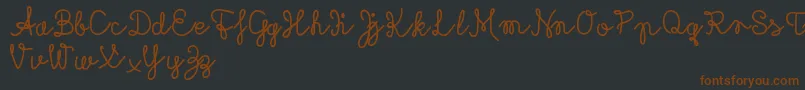 Rubicandemo Font – Brown Fonts on Black Background