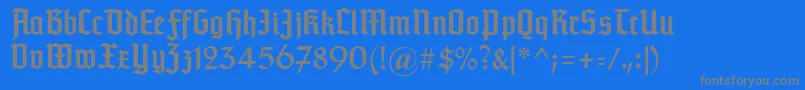 Typographertexturunz1-fontti – harmaat kirjasimet sinisellä taustalla