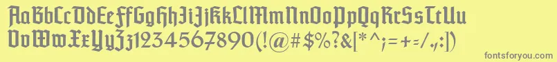 Typographertexturunz1-fontti – harmaat kirjasimet keltaisella taustalla