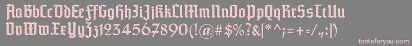 Typographertexturunz1-fontti – vaaleanpunaiset fontit harmaalla taustalla