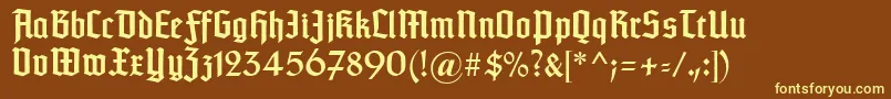 Fonte Typographertexturunz1 – fontes amarelas em um fundo marrom