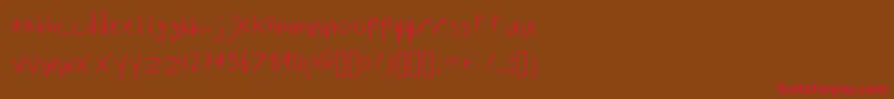 フォントInhadesRegular – 赤い文字が茶色の背景にあります。