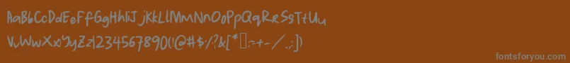 Lauwrites Font – Gray Fonts on Brown Background