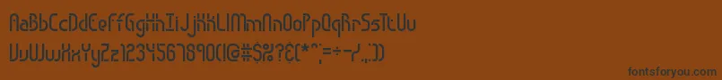 フォントObstacle – 黒い文字が茶色の背景にあります