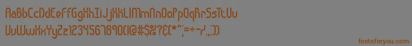 フォントObstacle – 茶色の文字が灰色の背景にあります。