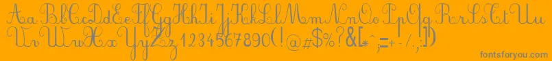 Czcionka PlumScript – szare czcionki na pomarańczowym tle