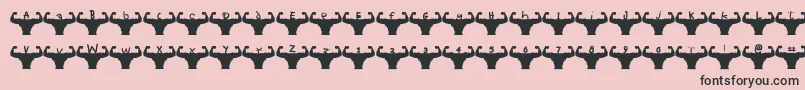 Themusclefetish-Schriftart – Schwarze Schriften auf rosa Hintergrund