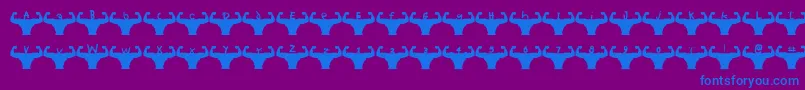 Czcionka Themusclefetish – niebieskie czcionki na fioletowym tle