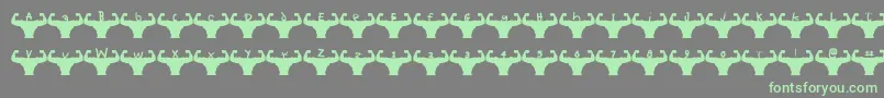 Fonte Themusclefetish – fontes verdes em um fundo cinza