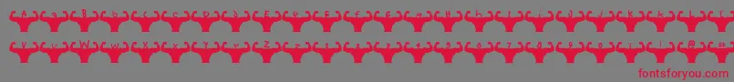 Themusclefetish Font – Red Fonts on Gray Background