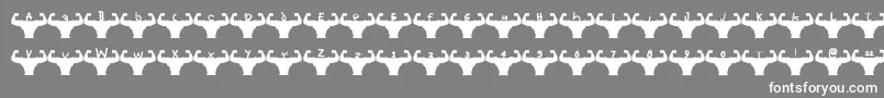 Themusclefetish-Schriftart – Weiße Schriften auf grauem Hintergrund
