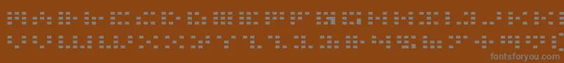 フォントIcone – 茶色の背景に灰色の文字