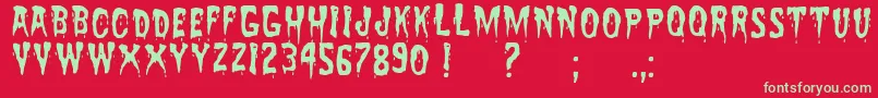 ZreaksNfi-Schriftart – Grüne Schriften auf rotem Hintergrund