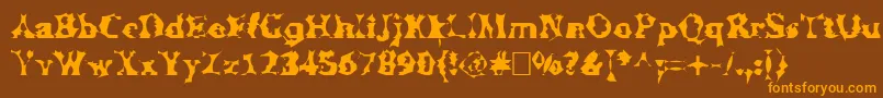 フォントManslem – オレンジ色の文字が茶色の背景にあります。