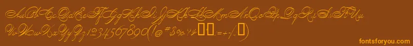 フォントPenmanScript – オレンジ色の文字が茶色の背景にあります。