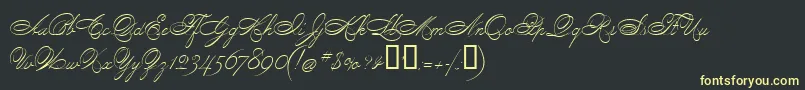 フォントPenmanScript – 黒い背景に黄色の文字