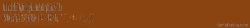 Czcionka FineNTall – szare czcionki na brązowym tle