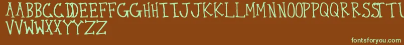フォントThirty – 緑色の文字が茶色の背景にあります。