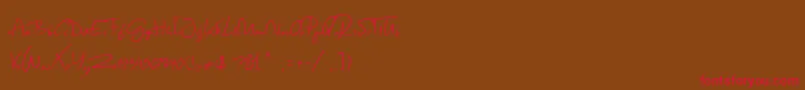 フォントSpringScript – 赤い文字が茶色の背景にあります。